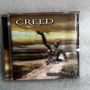 Creed Human Clay Album with Earthy Tones